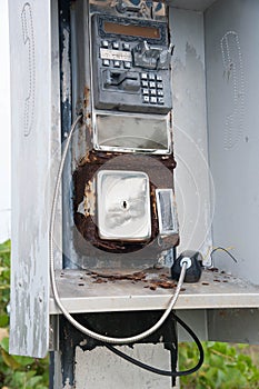 Broken pay phone handset and coin return