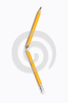 Broken pencil on white background on vertical background