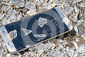 Broken phone on glass background