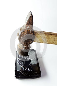 Broken phone screen and hammer