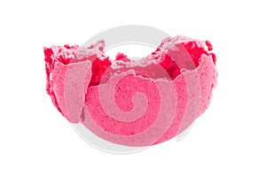 Broken pink macaron cake, over white background
