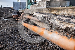 Broken pipes due to subsidence in the soil around the house