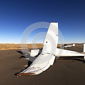 Broken plane on tarmac at airport.