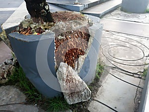 Broken plant pot in the garden.