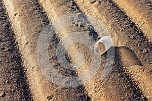 Broken Plastic Bottle Littering A Sandy Beach