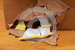 Broken plate in a cardboard box