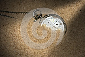 Broken Pocket Watch in the Sand