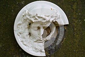 Broken porcelain Jesus Christ on historic cemetery in Lommel, Belgium