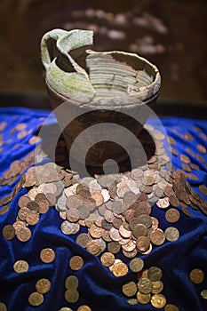 broken pot with coins
