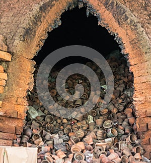 Broken pottery in stove for recycle