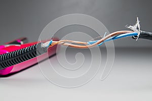Broken power cord for home electrical appliances. Damage to electrical cables for beauty electrical equipment. Soft focus