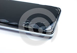 Broken protective glass on the smartphone screen