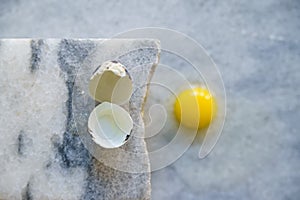 Broken quail egg with shell on white background