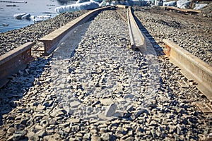 Broken railway in sea port