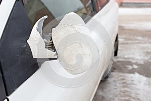 Broken rearview mirror on car.