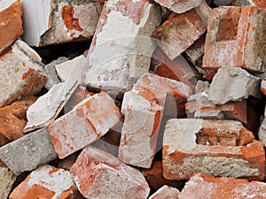 BROKEN RED CLAY BRICKS IN CONSTRUCTION SITE