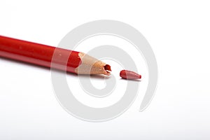 Broken red pencil.