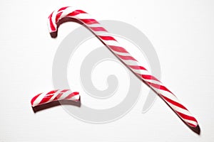 Broken Red and White Candy Cane on White Background