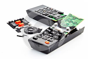 Broken remote control, smashed, broken and obsolete television control. technology used, technological waste