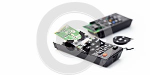 Broken remote control, smashed, broken and obsolete television control. technology used, technological waste