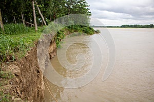 Broken river bank. Rivers of Bangladesh. The river is breaking with the strong current