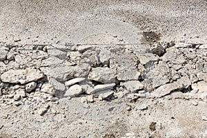 Broken Road crack Texture. After Construction drilled surface with jackhammer. Concrete broken from excavator drilling. The road w