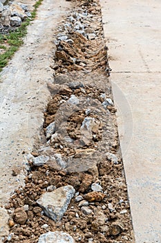 Broken Road crack Texture. After Construction drilled surface with jackhammer. Concrete broken from excavator drilling. The road w