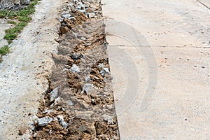 Broken Road crack Texture. After Construction drilled surface with jackhammer. Concrete broken from excavator drilling. The road w