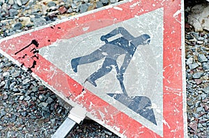 Broken road sign `road works` after an accident