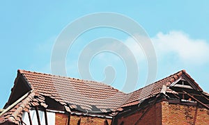 Broken roof and sky background