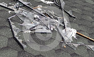 Broken roof after a storm. A large building with a damaged roof after a strong hurricane with broken glass and window