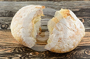 Broken round loaf of bread