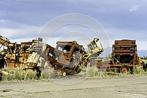 Broken and rusty old farm, military and construction vehicles.