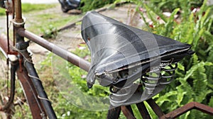 Broken rusty old and traditional bicycle seat