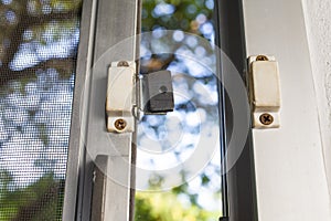 Broken security magnetic lock contact for mosquito wire screen window, Repair Room concept