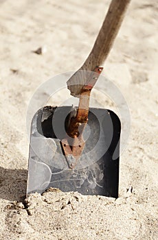 A broken shovel to dig in sand