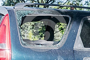 Broken side window in the car. Criminal incident