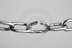 Broken silver metal chain, concept of freedom.