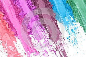 Broken and smashed make-up eyeshadow pallete on white background, top view