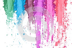 Broken and smashed make-up eyeshadow pallete on white background, top view