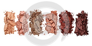 Broken and smashed make-up eyeshadow pallete on white background, top view