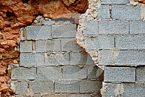 Broken stone and cinder block walls