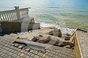 Broken stone steps leading to the seashore