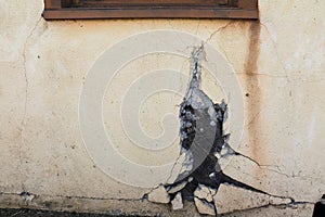 Broken stucco on old building