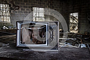 Broken television in an abandoned building