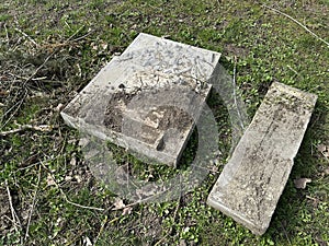 Broken tombstone in the public cemetery