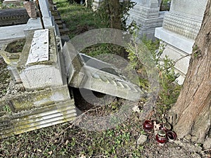 Broken tombstone in the public cemetery