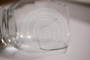 Broken transparent drinking glass in the kitchen