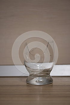 Broken transparent drinking glass in the kitchen