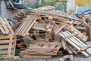 Broken trash broken furniture wood garbage. Wooden waste dumped beside a road